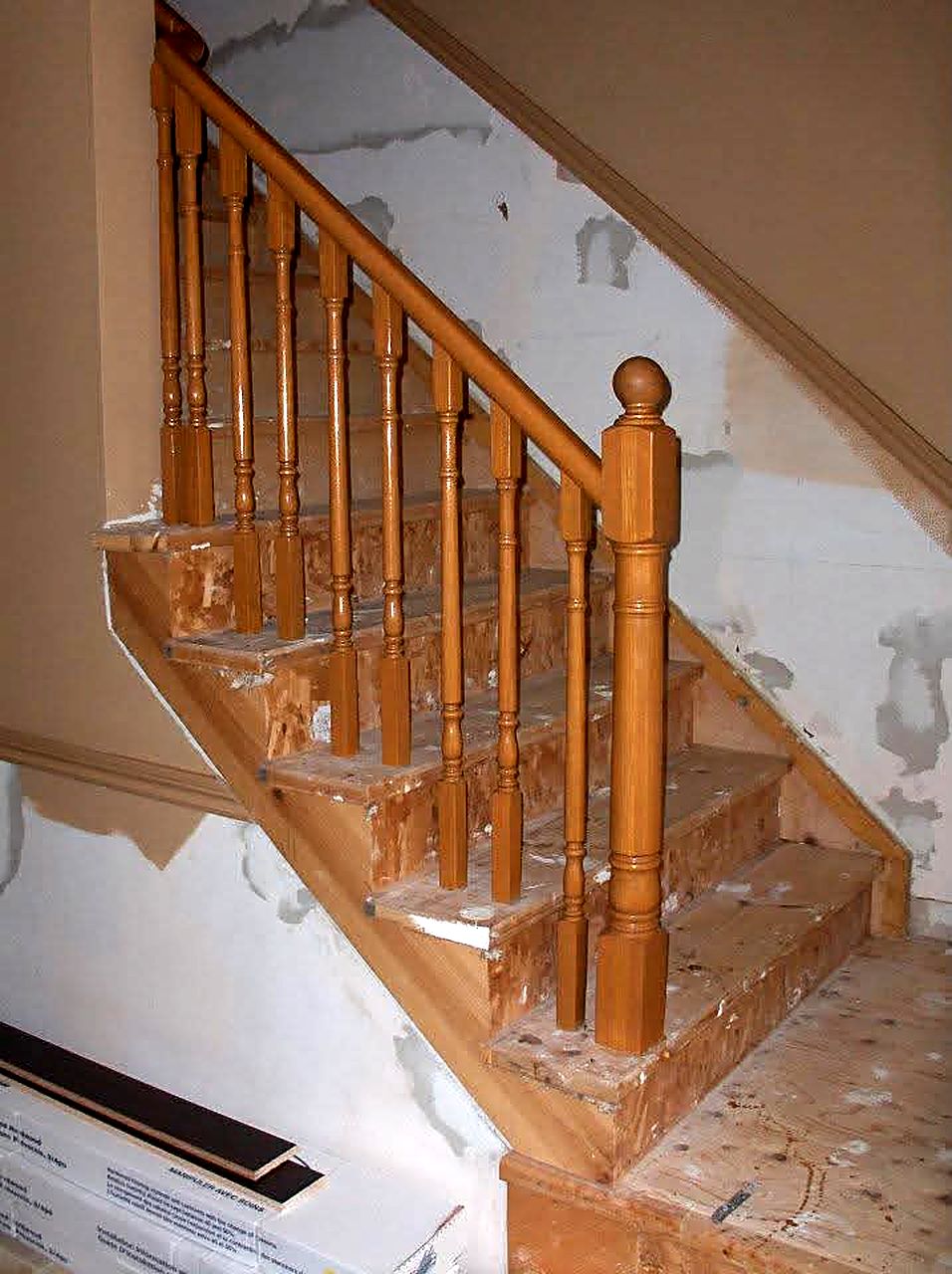 Oak staircase with turned spindles during renovation